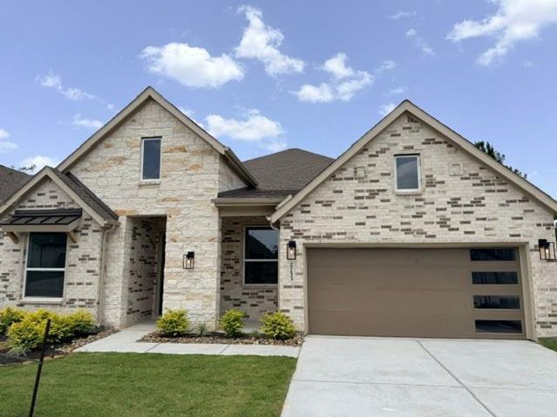 Front exterior of a new home in Kresston, Montgomery, TX, highlighting curb appeal (Image 2).