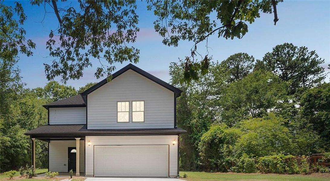Front exterior of a new home in , Griffin, GA, highlighting curb appeal (Image 1).