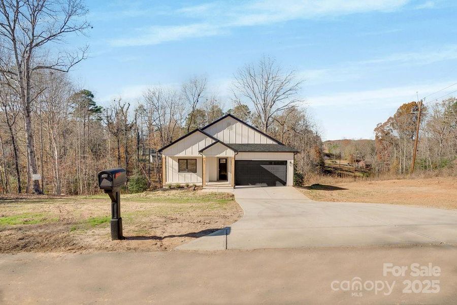 Front exterior of a new home in , Lincolnton, NC, highlighting curb appeal (Image 1).