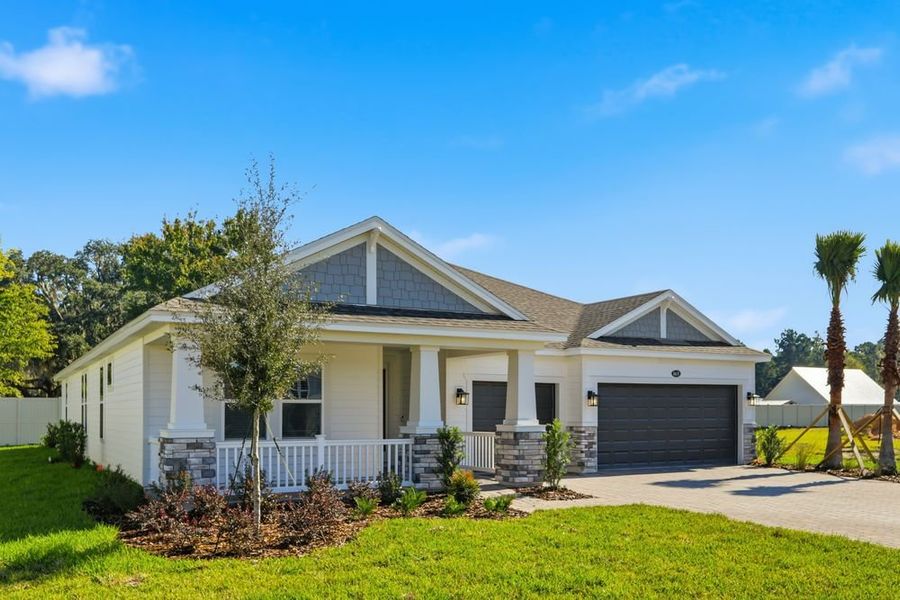 Front exterior of a new home in Headwaters at Lofton Creek, Yulee, FL, highlighting curb appeal (Image 2).