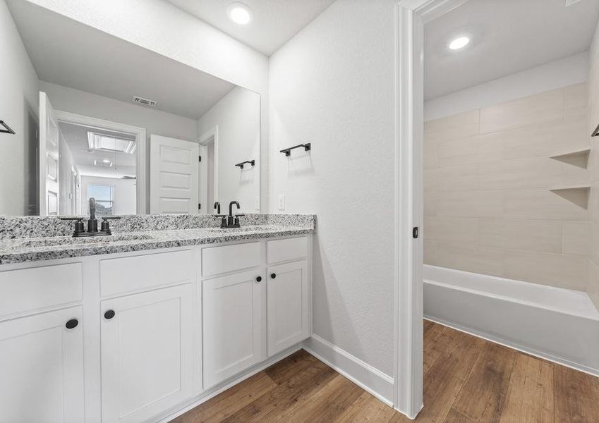 Jack and Jill secondary bathroom with upgraded dual sink vanity.