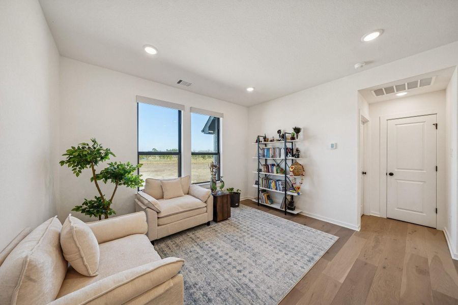To the left is the smaller of the 2 game rooms, this one makes  a perfect sitting area or library.