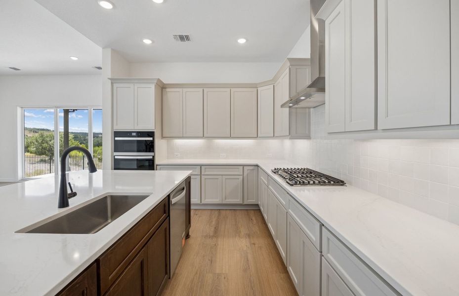 Representative furnished interior of a home built from the Wheeler by Pulte Homes in West Cypress Hills, Spicewood (Image 5).