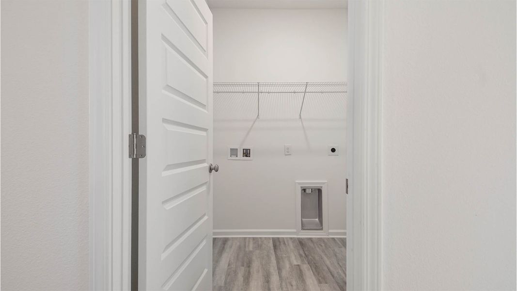 Representative unfurnished interior of a home built from the Aspen by D.R. Horton in Owl's Head East, Freeport (Image 22).