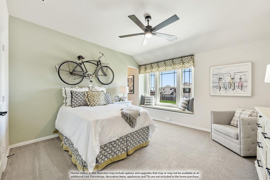 Bedroom with vaulted ceiling, ceiling fan, bay window seat, and decorative bicycle mounted on wall