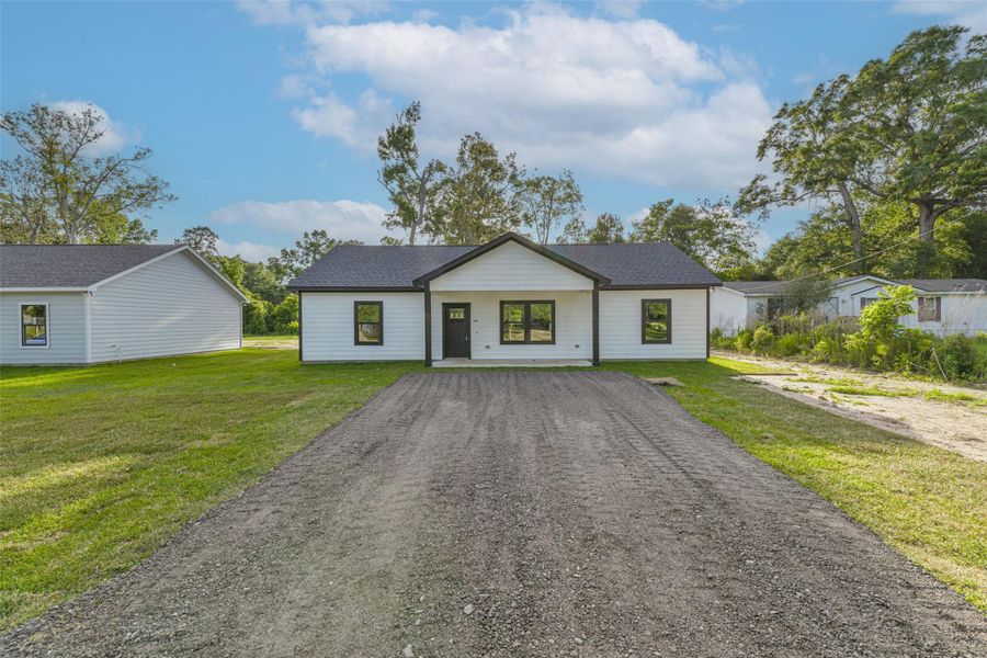 Front exterior of a new home in , Splendora, TX, highlighting curb appeal (Image 19). Front exterior of a new home in , Splendora, TX, highlighting curb appeal (Image 19).