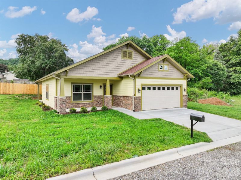 Front exterior of a new home in , Waynesville, NC, highlighting curb appeal (Image 17).