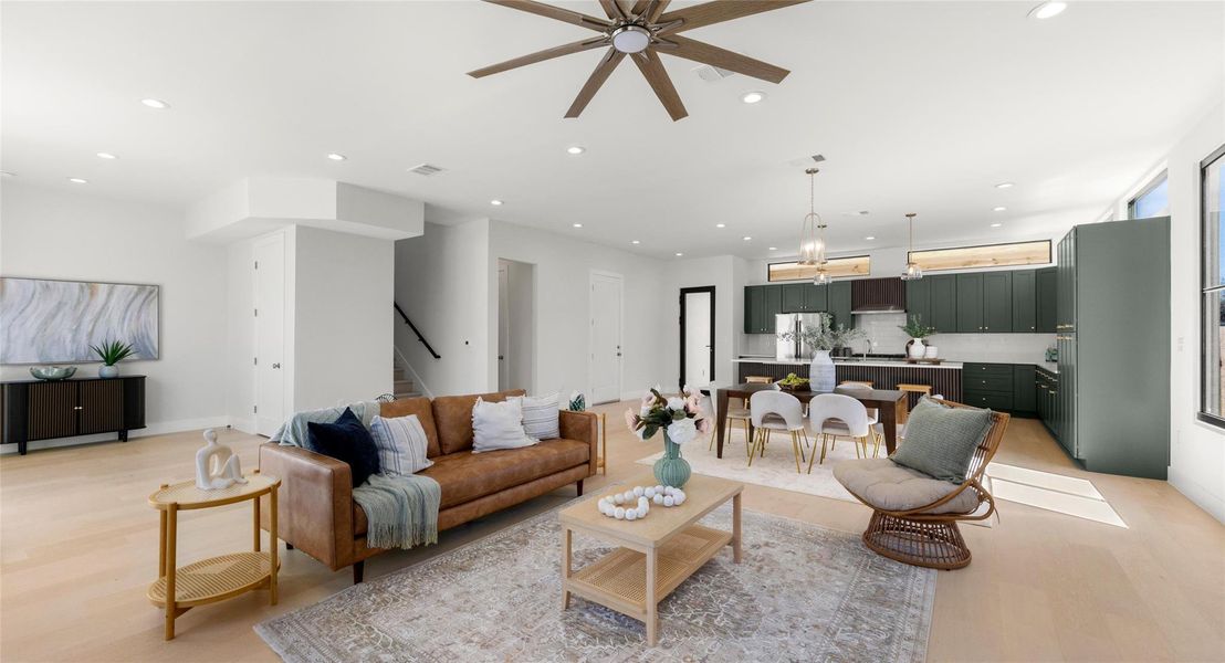 Living area with ceiling fan, light wood-type flooring, and recessed lighting