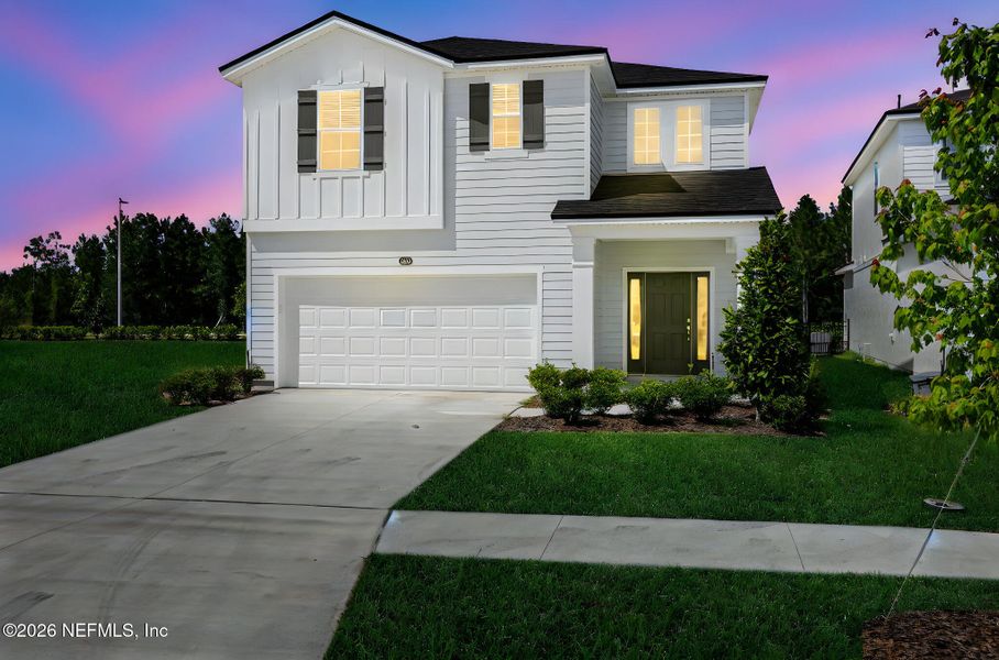 Front exterior of a new home in Amberly, Green Cove Springs, FL, highlighting curb appeal (Image 23).