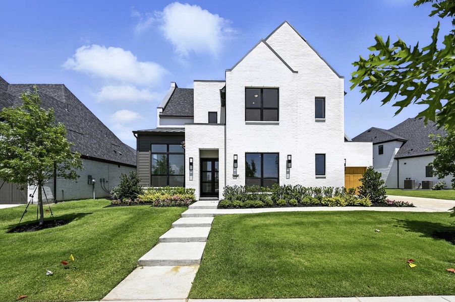 Front exterior of a new home in Mosaic: 70ft. lots, Celina, TX, highlighting curb appeal (Image 1).