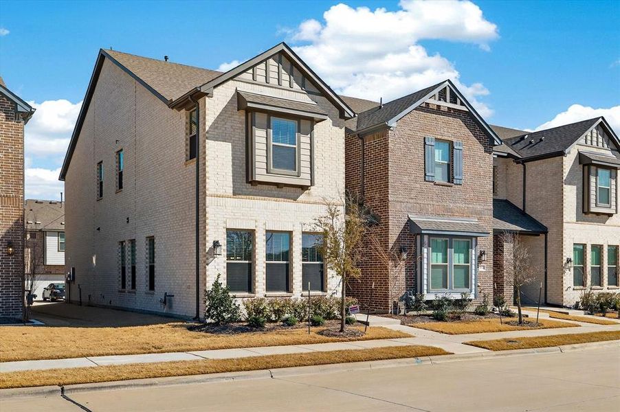 Front exterior of a new home in , Sachse, TX, highlighting curb appeal (Image 21).