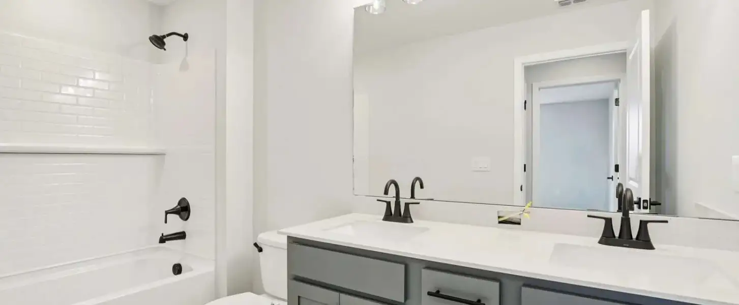 Bathroom 2 shared by the secondary bedrooms will feature aspects of AW Collection® Coastal - Representative images and renderings are for illustrative purposes. Actual structural options and design finishes of home may vary.