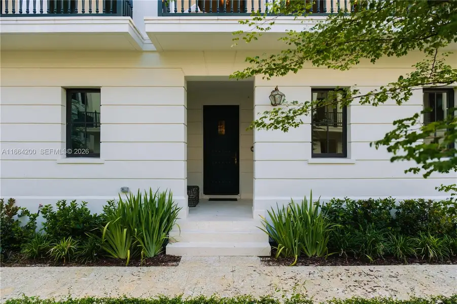 Exterior details and patio area of a home in The Village at Coral Gables, Coral Gables (Image 20).