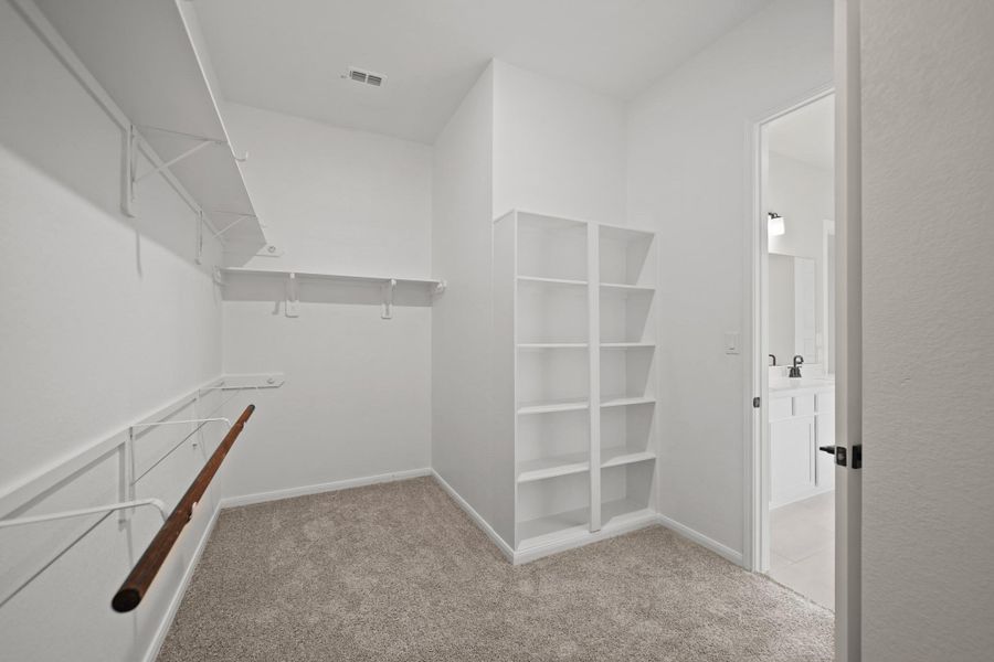 Walk-in closet in owner's suite (*Photo not of actual home and used for illustration purposes only.) Walk-in closet in owner's suite (*Photo not of actual home and used for illustration purposes only.)