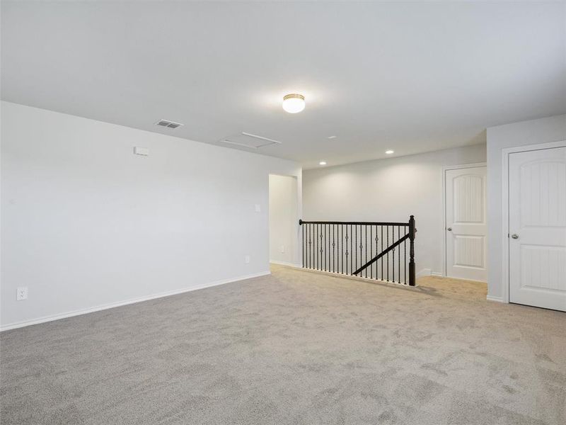 Unfurnished room with visible vents, attic access, carpet floors, and recessed lighting Unfurnished room with visible vents, attic access, carpet floors, and recessed lighting