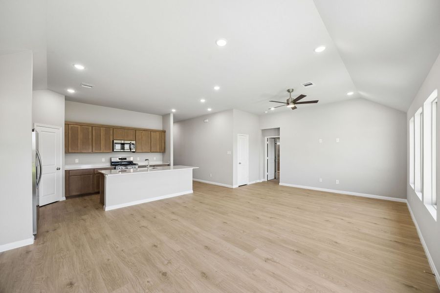 Dining and Living Area in the Sabine home plan by Trophy Signature Homes – REPRESENTATIVE PHOTO Dining and Living Area in the Sabine home plan by Trophy Signature Homes – REPRESENTATIVE PHOTO