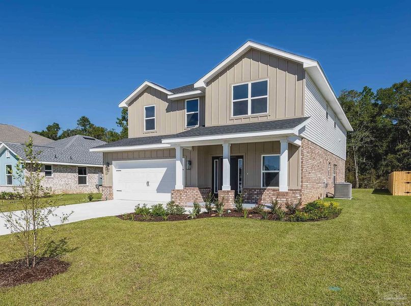 Front exterior of a new home in Parkland Place, Pace, FL, highlighting curb appeal (Image 2). Front exterior of a new home in Parkland Place, Pace, FL, highlighting curb appeal (Image 2).