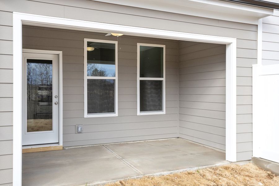 Exterior details and patio area of a home in Ovation at Sweetbrier, Durham (Image 20).