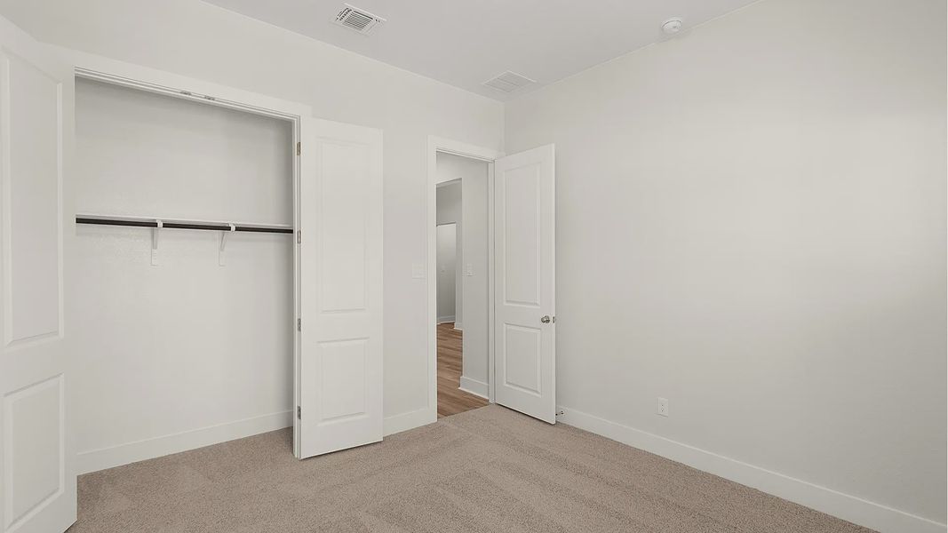 Representative unfurnished interior of a home built from the Brenner by Chesmar Homes in Newhaven, Manor (Image 23).