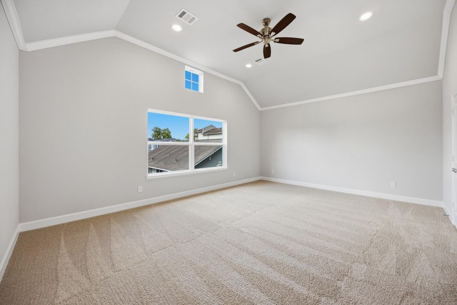 Your serene haven awaits. A vaulted ceiling and access to two closets and an en suite bathroom enhance the luxury of this spacious retreat.