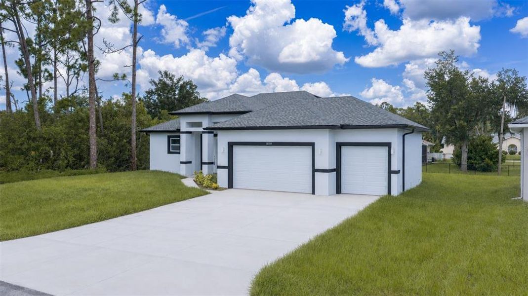 Front exterior of a new home in , Port Charlotte, FL, highlighting curb appeal (Image 27).