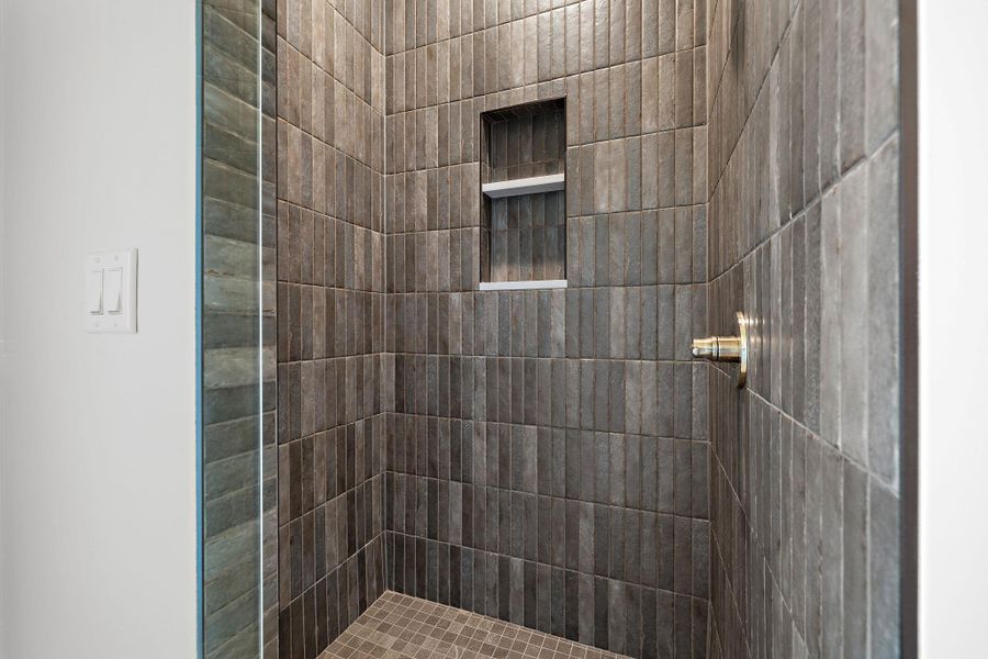 Bathroom with a tile shower