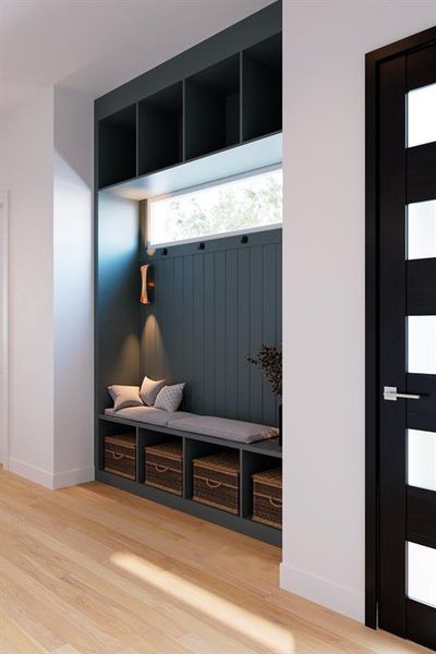Mudroom with light wood finished floors and baseboards