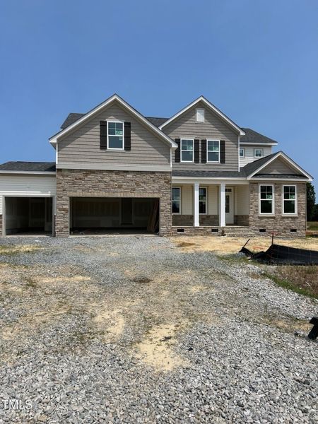 Front exterior of a new home in Tobacco Road, Angier, NC, highlighting curb appeal (Image 68).