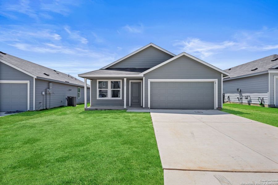 Front exterior of a new home in Lodi Grove, Floresville, TX, highlighting curb appeal (Image 1).