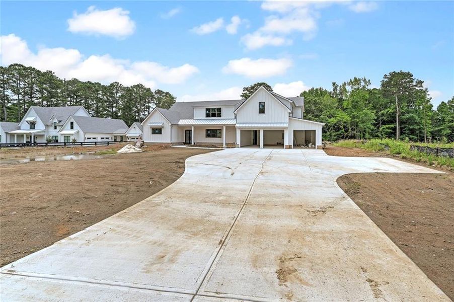 Front exterior of a new home in , Woodstock, GA, highlighting curb appeal (Image 2). Front exterior of a new home in , Woodstock, GA, highlighting curb appeal (Image 2).