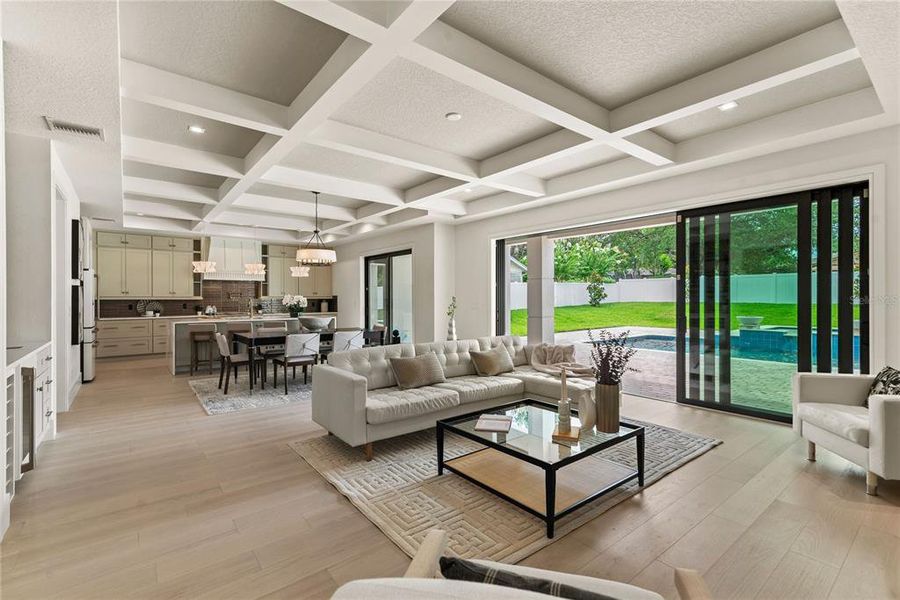 Sliding glass doors leading to the backyard oasis for a seamless indoor-outdoor living experience Sliding glass doors leading to the backyard oasis for a seamless indoor-outdoor living experience