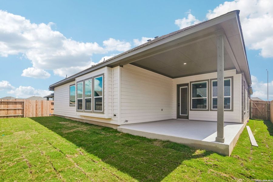 Exterior details and patio area of a home in Village at Three Oaks, Seguin (Image 3).