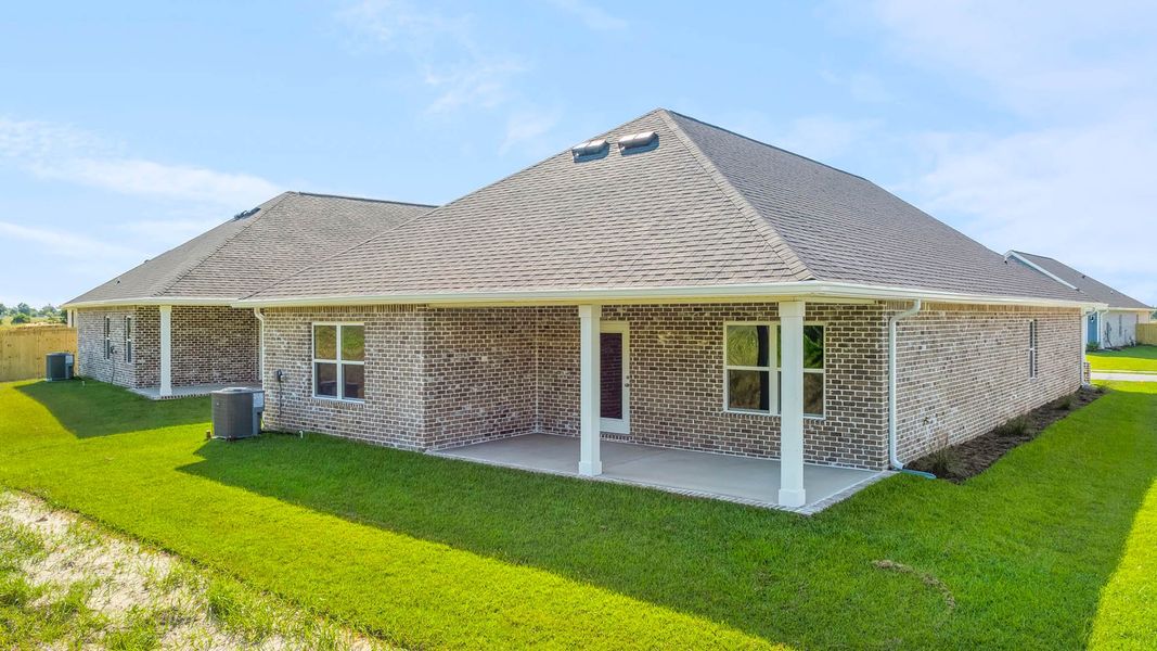 Front exterior of a new home in Owl's Head Farms, Freeport, FL, highlighting curb appeal (Image 15).