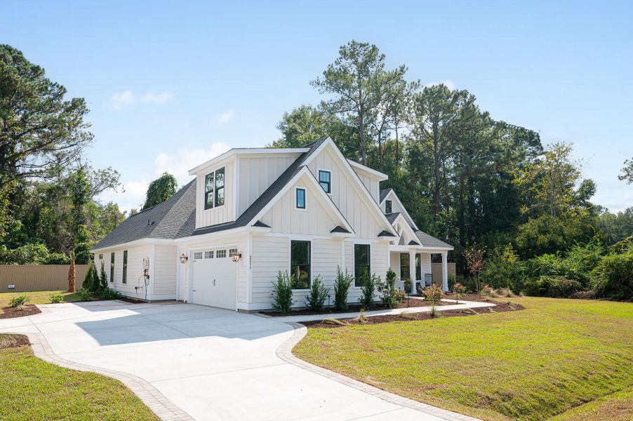 Front exterior of a new home in Yellow House Landing, Charleston, SC, highlighting curb appeal (Image 1). Front exterior of a new home in Yellow House Landing, Charleston, SC, highlighting curb appeal (Image 1).