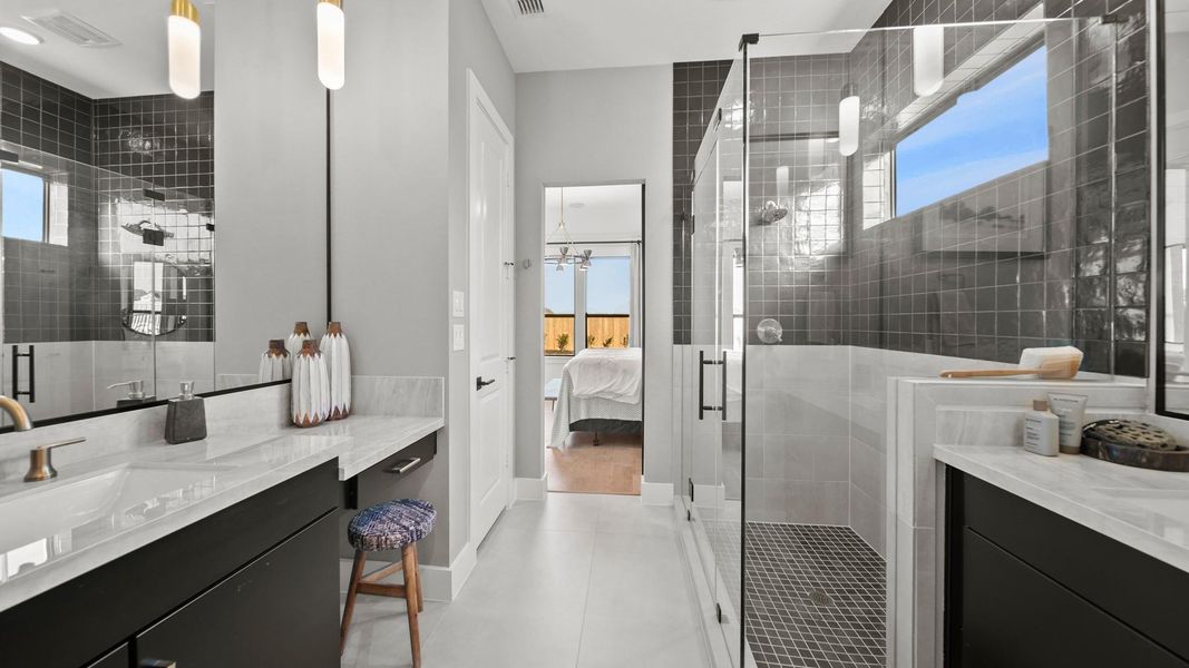 A sizable vanity with space for a sit-down chair is another quite pleasing feature this bathroom offers. The sinks are conveniently located on opposite sides of the bathroom to allow for more space while you get ready! A sizable vanity with space for a sit-down chair is another quite pleasing feature this bathroom offers. The sinks are conveniently located on opposite sides of the bathroom to allow for more space while you get ready!