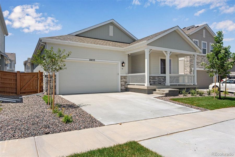 Front exterior of a new home in Reunion Ridge, Commerce City, CO, highlighting curb appeal (Image 2).
