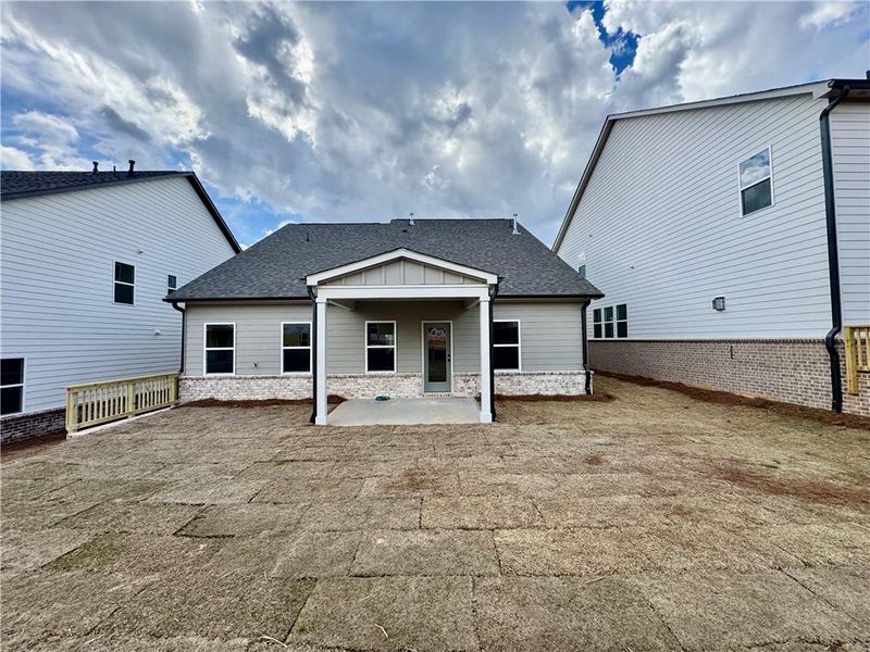 Exterior details and patio area of a home in Eastlyn Crossing, Flowery Branch (Image 3).