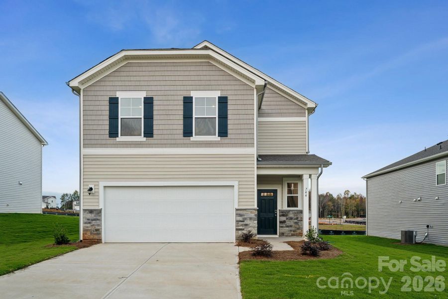 Front exterior of a new home in Carpenter Farms, Lincolnton, NC, highlighting curb appeal (Image 1). Front exterior of a new home in Carpenter Farms, Lincolnton, NC, highlighting curb appeal (Image 1).