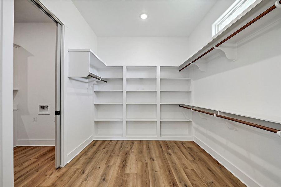 Master bedroom closet is huge with plenty of hanging and storage space.  Opens to utility room for convenience.