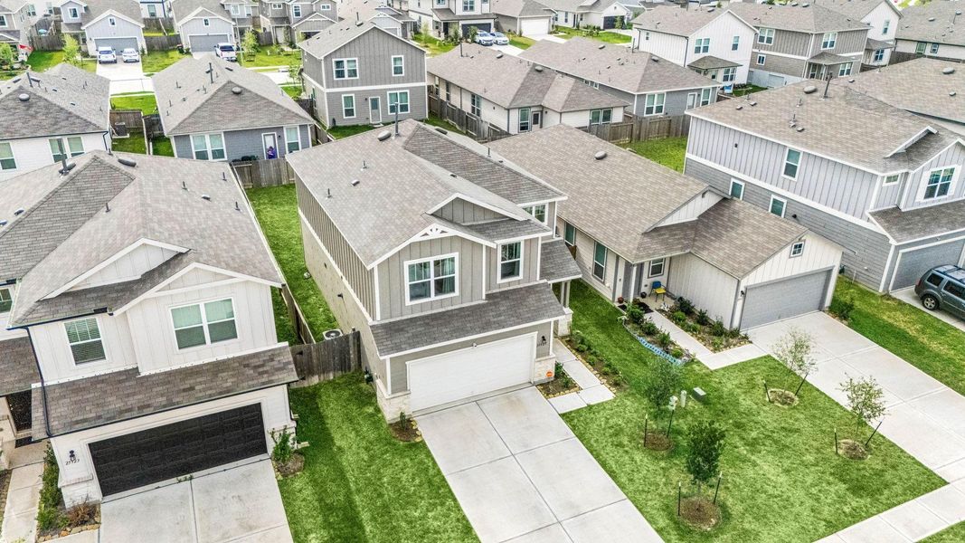 Front exterior of a new home in Decker Farms, Magnolia, TX, highlighting curb appeal (Image 21). Front exterior of a new home in Decker Farms, Magnolia, TX, highlighting curb appeal (Image 21).