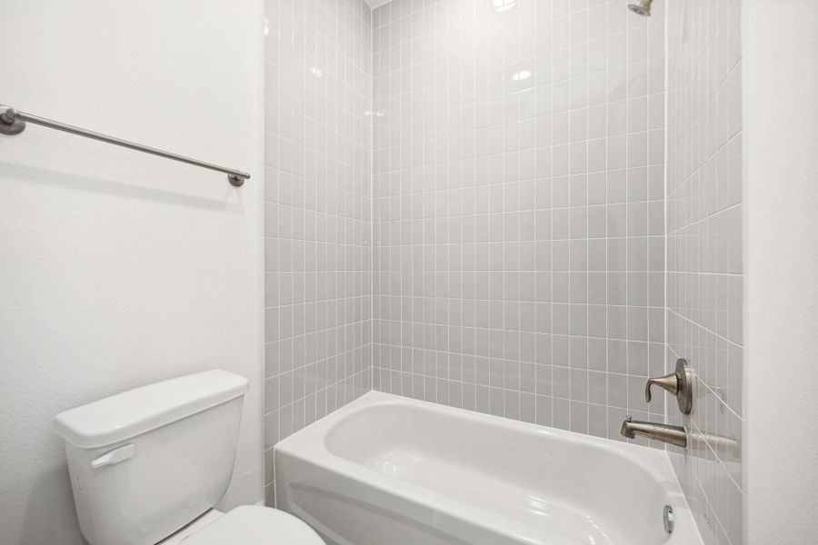 Privacy where it counts, and style that goes all the way up. Full-height tile and thoughtful design make this space a quiet standout. Privacy where it counts, and style that goes all the way up. Full-height tile and thoughtful design make this space a quiet standout.