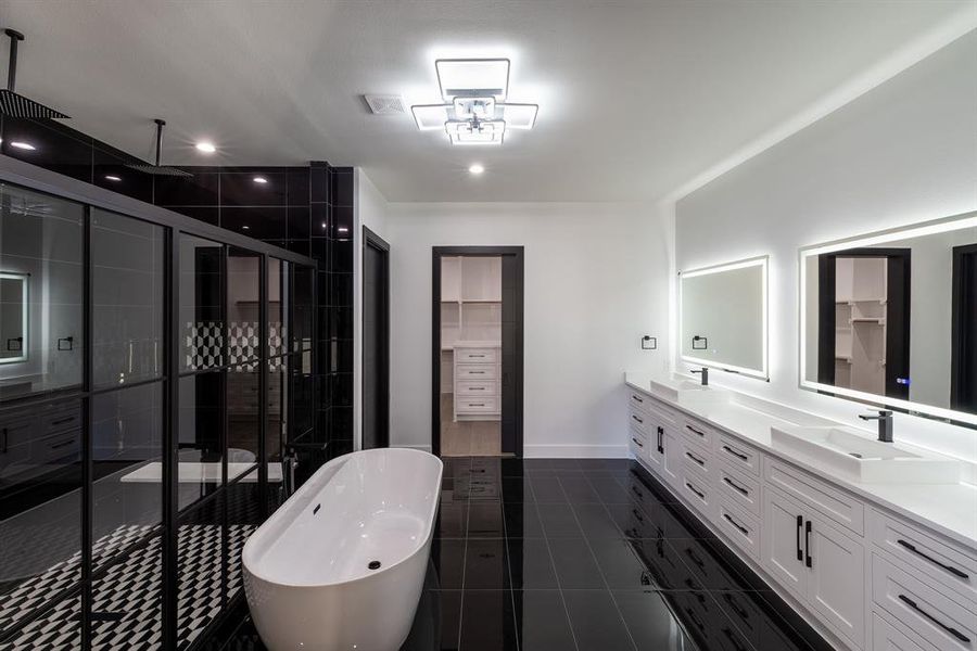 Bathroom with independent shower and bath, vanity, and tile patterned flooring