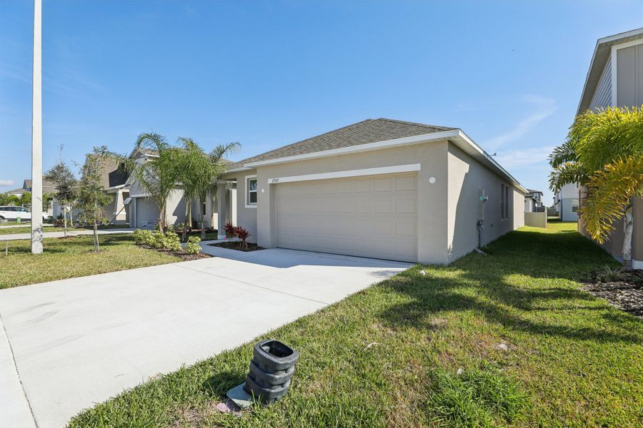 Representative exterior photo of a completed home built from the Vista by Maronda Homes in Heritage Station, Punta Gorda, FL (Image 20).
