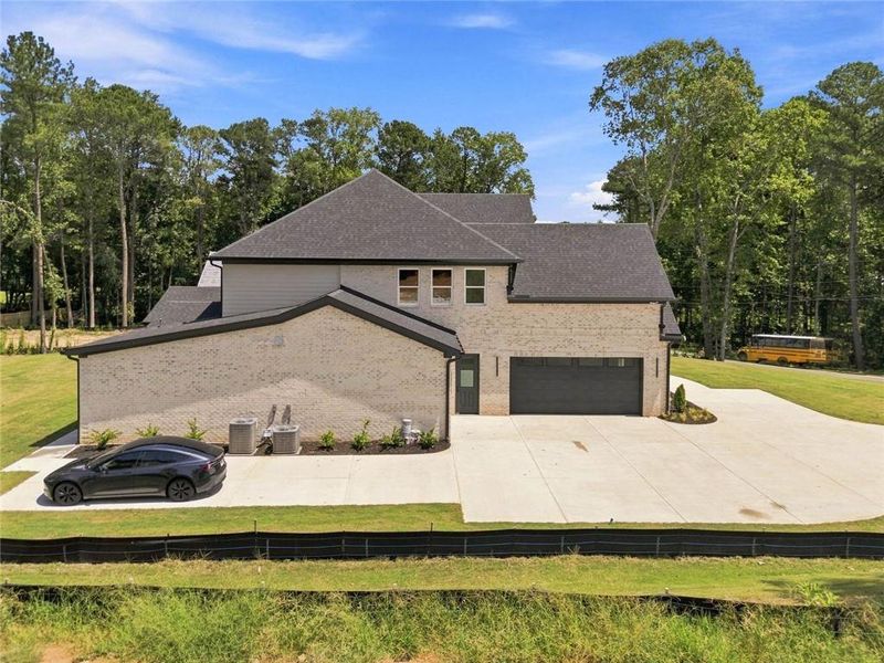 Front exterior of a new home in , Loganville, GA, highlighting curb appeal (Image 28).