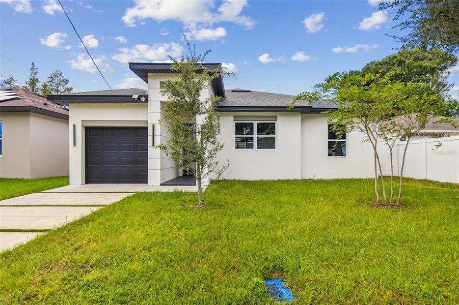 Front exterior of a new home in , Tampa, FL, highlighting curb appeal (Image 33).