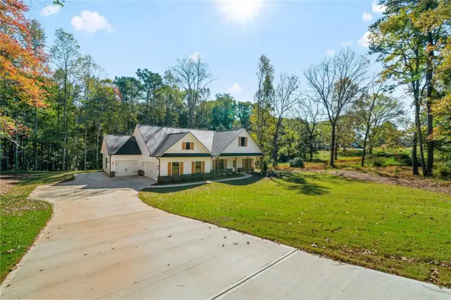 Front exterior of a new home in , Bremen, GA, highlighting curb appeal (Image 2). Front exterior of a new home in , Bremen, GA, highlighting curb appeal (Image 2).