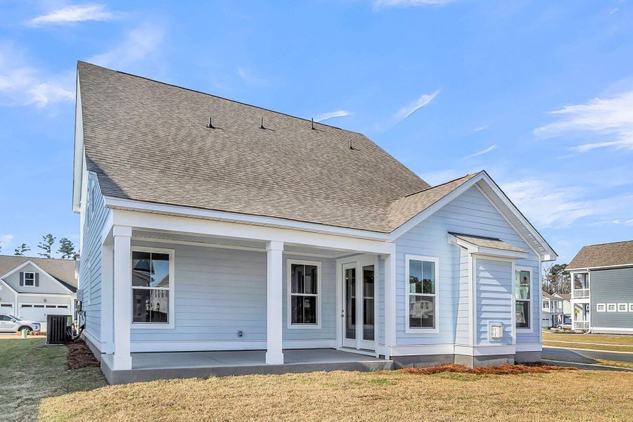 Exterior details and patio area of a home in Tidewater at Lakes of Cane Bay, Summerville (Image 25).