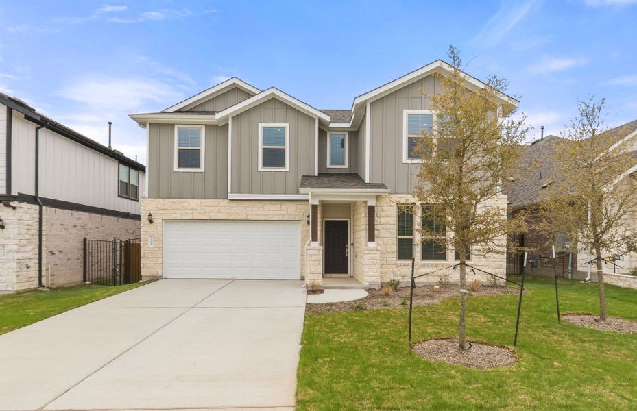 Front exterior of a new home in Saddleback at Santa Rita Ranch, Liberty Hill, TX, highlighting curb appeal (Image 23).