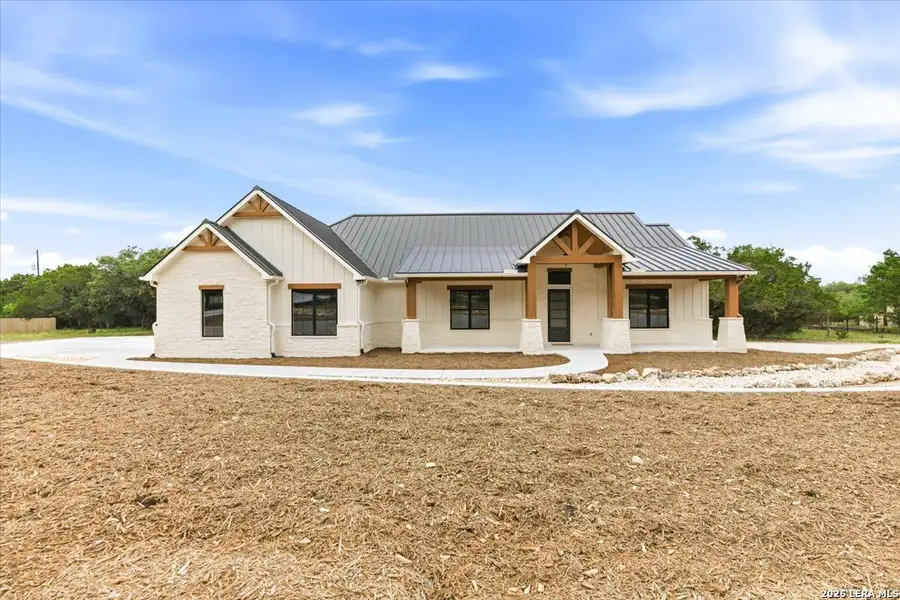 Front exterior of a new home in , Canyon Lake, TX, highlighting curb appeal (Image 25).