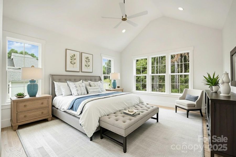 Main-level primary suite (virtually staged) Main-level primary suite (virtually staged)